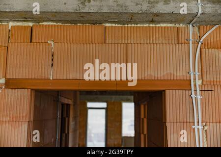 Indoor construction site with windows and brown bricks Stock Photo