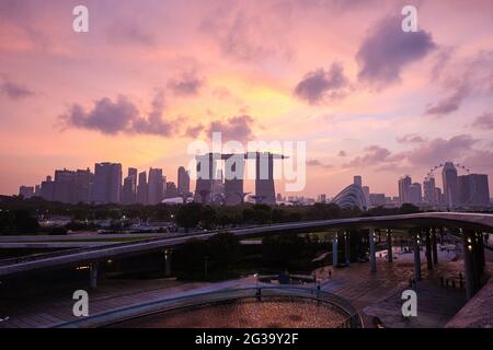 A Golden Hour Sunset at Marina Barrage, overlooking Marina Bay Sands, Gardens by the Bay, Singapore Flyer, and the Financial District Stock Photo
