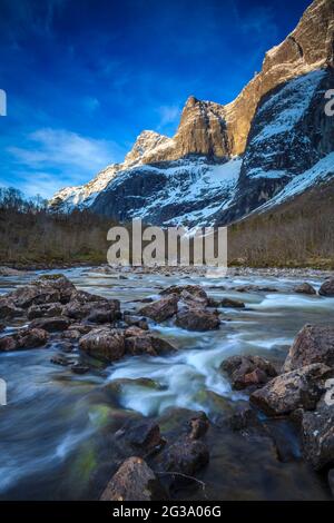 Early morning spring sunlight in the mountainous area of Romsdalen valley, Rauma kommune, Møre og Romsdal, Norway, Scandinavia. Stock Photo