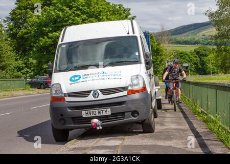 Commercial vehicles & trailer Advertising by parking on pavement across Motorway bridge restricting busy traffic access in Chorley, UK Highway Code rule 242 states: 'You must not leave your vehicle or trailer in a dangerous position or where it causes any unnecessary obstruction of the road Stock Photo