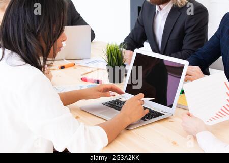 Diverse executive business people team discussing work results at meeting, multiracial businessmen talking analyzing financial statistics report sitti Stock Photo