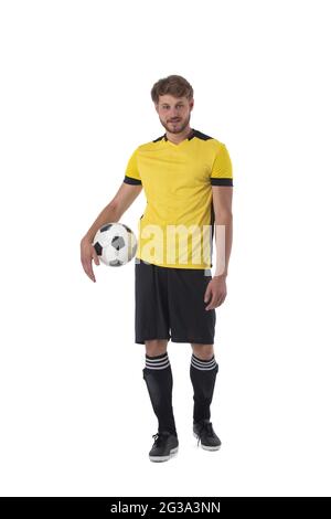 Soccer player is holding ball isolated on white background Stock Photo