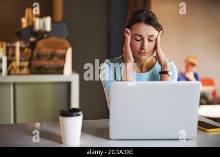 Beautiful elegant woman concerned making difficult decision while she is lost in thoughtful reflecting Stock Photo