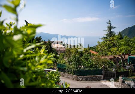 Gardola, Italy. 14th June, 2021. View from the village over Lake Garda. Credit: Daniel Reinhardt/dpa/Alamy Live News Stock Photo