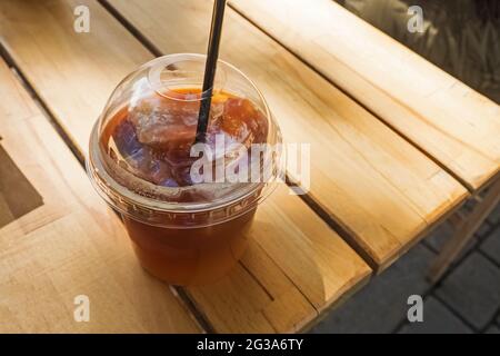 Iced coffee to go. Frozen coffee ice cubes in a vacuum flask poured with  milk. Thermos lid near the bottle. White background. Isolated, copy space  Stock Photo - Alamy