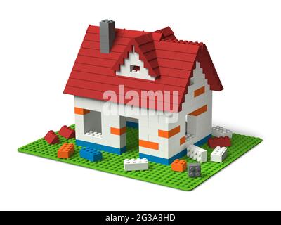 Building home concept, an individual house made of colorful plastic toy building blocks, 3D construction isolated on white backgroun Stock Photo