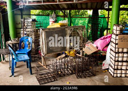 The junk room on a mushroom farm collects a variety of new and old equipment on Bang Krachao Island in Bangkok, Thailand. Stock Photo