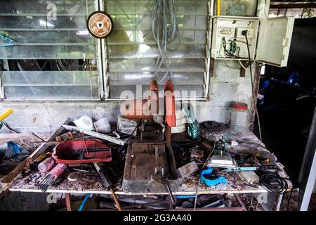 The workbench of a local mushroom farmer is a well-used mess on Bang Krachao Island in Bangkok, Thailand. Stock Photo