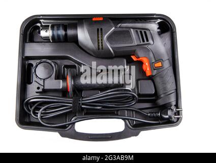 Electric drill in a suitcase. Keyless chuck. Gear teeth. Close-up tool. Metal details. Worker mechanics and tools Stock Photo