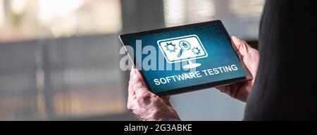 Tablet screen displaying a software testing concept Stock Photo