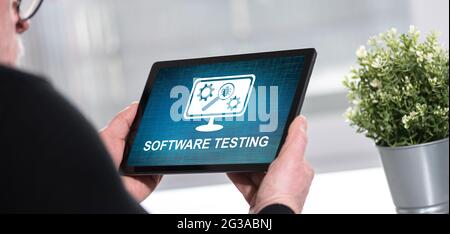 Tablet screen displaying a software testing concept Stock Photo