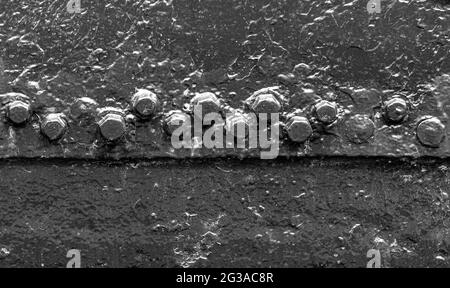 Rivet background on the old painted ship's side Stock Photo