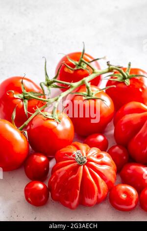 Group of Rich Ripe Red Tomatoes Isolated on a Plain Background with COPYSPACE Stock Photo