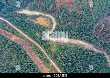 Aerial view of the mountains in autumn. The road along the winding river. Beautiful nature landscape. Prut River, Carpathian mountains. Ukraine Stock Photo