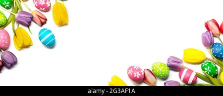 Easter tulips and eggs isolated on white background, border frame corner composition with copy space for text Stock Photo