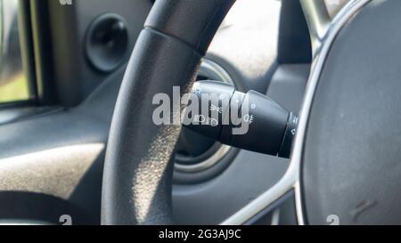 Detailing the car. Close-up of the left arm of the car turn signal. Gearshift light in the interior of the car Stock Photo