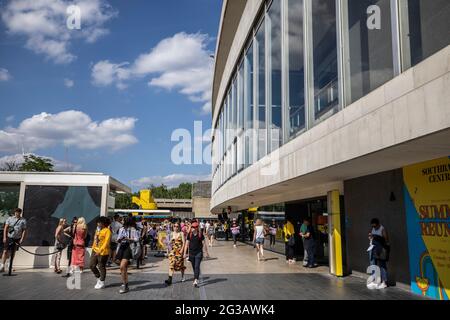 People walk along the South Bank area in Central London, England, United Kingdom Stock Photo