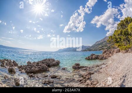 Amazing Croatian beaches against sunset in Brela, Dalmatia, Croatia Stock Photo