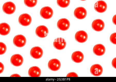 Tomatoes creative pattern background, ripe tomatoes isolated on white, top view. Stock Photo
