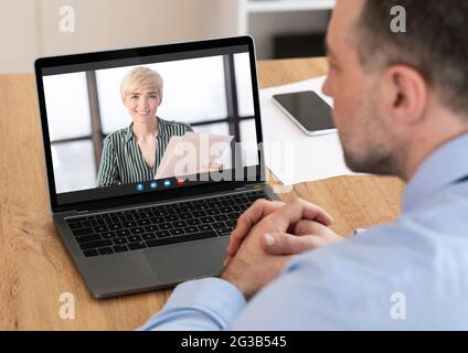 Online Interview. Unrecognizable Man Having Virtual Meeting With Female HR Manager, Using Laptop For Video Call For Job Recruitment, Business People E Stock Photo