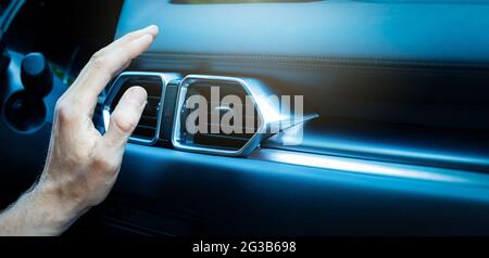 hand checking air conditioner in car. climate control. copy space Stock Photo