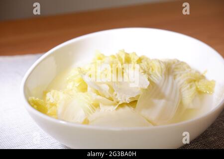 Chinese cuisine: Baby cabbage in chicken soup Stock Photo