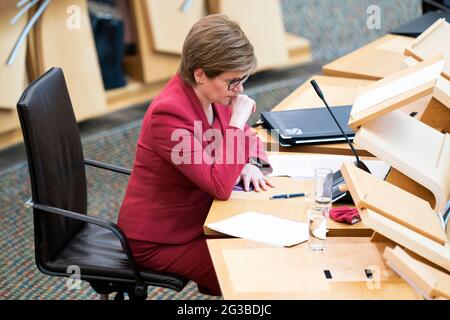 First Minister Nicola Sturgeon in the Scottish Parliament in Edinburgh to update MSPs on any changes to the Covid-19 restrictions in Scotland. Picture date: Tuesday June 15, 2021. Stock Photo