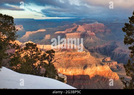 A spectacular view of the Grand Canyon with the last of the winter snows in the foreground, in Arizona, The USA Stock Photo