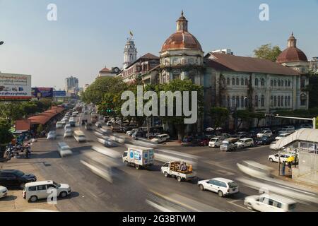 Yangon, Myanmar - December 19, 2019: Traffic jams in Yangon, in front of the Yangon Divisional Court building over Strand Road Stock Photo