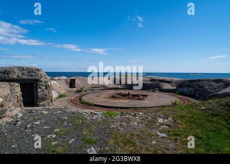 the beautiful coast of norway with its rock formations and blue water on a beautiful summer day  with old bunkers from the second world war Stock Photo