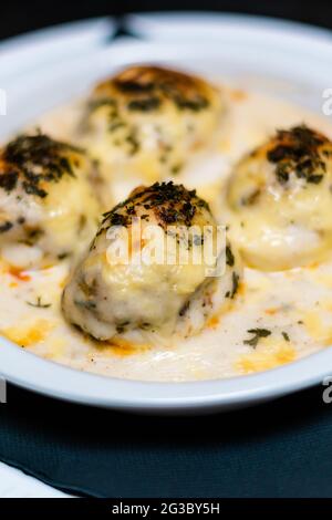 close up view of homemade baked gratin eggs and deviled eggs Stock Photo
