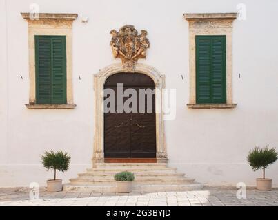 The front of an old white house in Ostuni ('The White City') Stock Photo