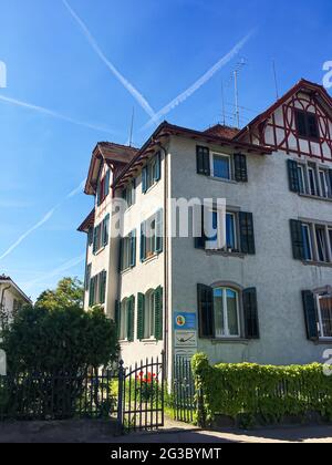 Historic building and house on street of Richterswil, canton of Zurich in Switzerland, Swiss architecture and real estate Stock Photo