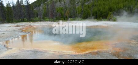 Late Spring in Yellowstone National Park: Emerald Pool of the Emerald Group in the Black Sand Basin Area of Upper Geyser Basin Stock Photo