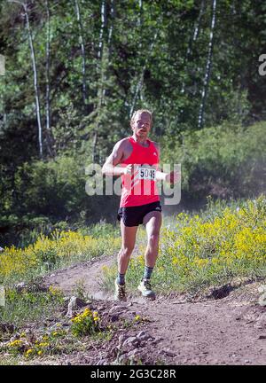 June 13, 2021: Colorado based mountain runner, Jacob Dewey, nears the finish of the 2021 Adidas Terrex 10K Spring Runoff at the GoPro Mountain Games, Vail, Colorado. Stock Photo
