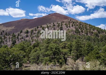 The sunset crater cinder cone volcano in Sunset Crater National Monument near Flagstaff Arizona Stock Photo