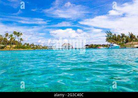 Overwater bungallows at South Male Atoll, Olhuveli island Maldives at Indian Ocean,Island with palm-lined beaches & an all-inclusive resort Stock Photo