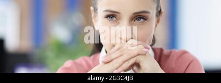 Portrait of young beautiful brunette woman at workplace Stock Photo