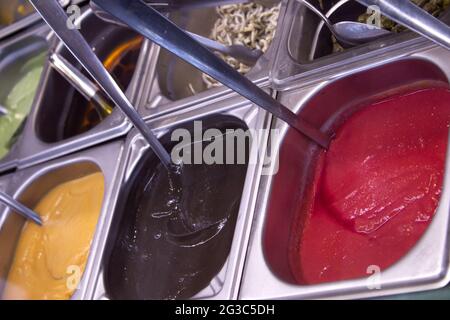 Different sauces such as tomato, mustard and mayonnaise. No people Stock Photo