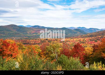 Majestc forested mountain landscape during the autumn colour season on a partly cloudy day Stock Photo