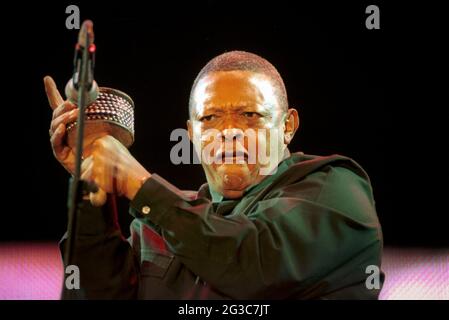 Hugh Masekela, famous South African jazz musician, performing with shaker at Celebrate South Africa concert, Trafalgar Square, London, UK. Stock Photo