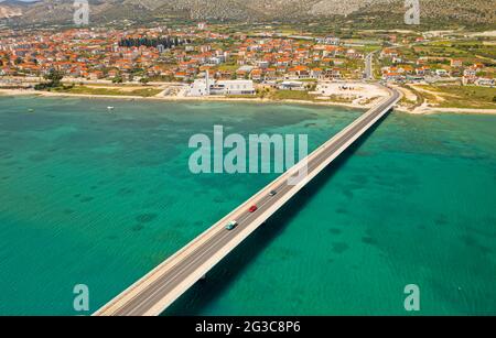 Aerial top view of a long bridge above a sea, island Ciovo in Croatia Stock Photo