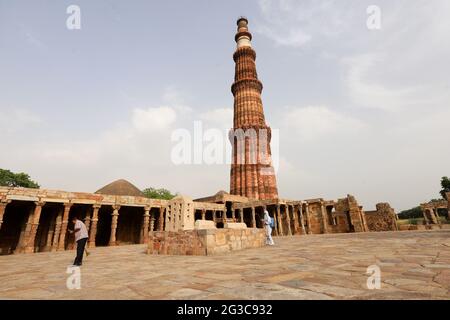 New Delhi, India. 15th June, 2021. A worker wearing a Personal Protective Equipment suite (PPE) chemically disinfects the premises of the Qutub Minar complex ahead of its reopening to the public after the lockdown in New Delhi. Indian Statistical Institute (ASI) Protected monuments and museums are scheduled to reopen from June 16th. Delhi has over 70 monuments under ASI, including Red Fort, Humayuns Tomb, Qutub Minar and Purana Qila. (Photo by Amarjeet Kumar Singh/SOPA Images/Sipa USA) Credit: Sipa USA/Alamy Live News Stock Photo