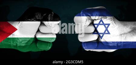 On Going Conflict and Tension Between Two Countries Palestine and Israel Represented with Flags Painted on Fist Stock Photo