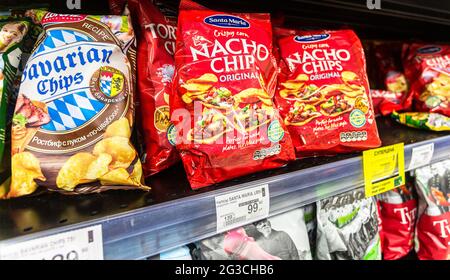 Samara, Russia - June 13, 2021: Assorted packs of potato chips to sale on the shelf in superstore Stock Photo