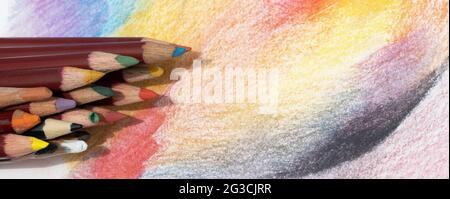 many multi-colored pencils for drawing on colored paper Stock Photo