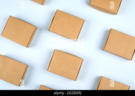 Paper boxes on light background. Top view, flat lay. Zero waste concept, eco gifts Stock Photo