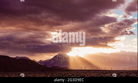 Dramatic sunset in Sierra Nevada's rays of light and clouds  Stock Photo