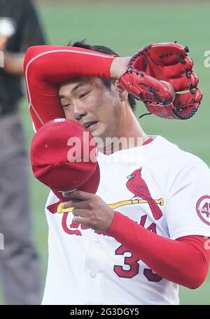 St. Louis, United States. 15th June, 2021. St. Louis Cardinals starting pitcher Kwang Hyun Kim wipes his face after walking Miami Marlins starting pitcher Trevor Rogers in the second inning at Busch Stadium in St. Louis on Tuesday, June 15, 2021. Photo by Bill Greenblatt/UPI Credit: UPI/Alamy Live News Stock Photo