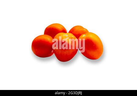 Set of fresh juicy red tomatoes isolated on white background. Stock Photo